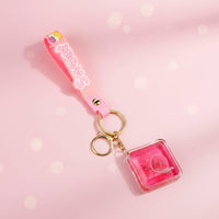 Glitter cartoon keychain on backpack